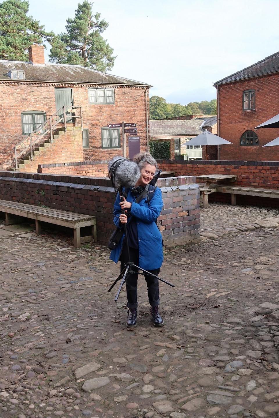 Sound artist Dr Brona Martin in the Erddig stable yard