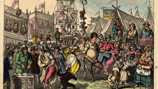 Thomas Howell Jones, ‘The Statute Fair’, c.1830 © The Trustees of the British Museum. The image shows a busy fair scene, with people dancing in the foreground, accompanied by musicians that include a man playing panpipes and a drum. 